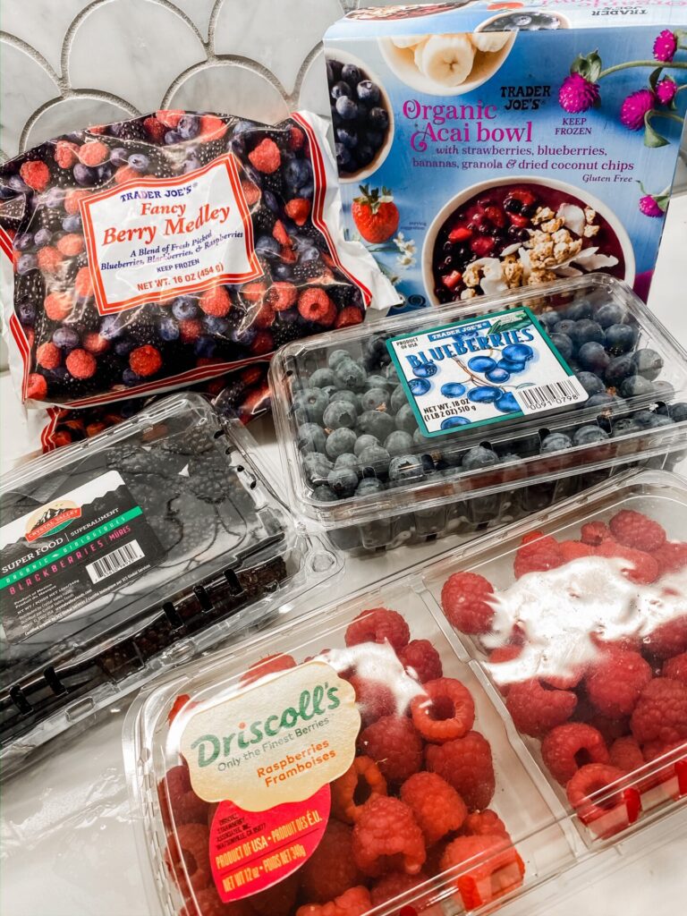 Trader Joe's Haul by popular Nashville lifestyle blog, Hello Happiness: image of Trader Joe's Fancy Berry medley, carton of blueberries, carton of blackberries, carton of Driscoll's raspberries, and Trader Joe's Organic Acai Bowl. 