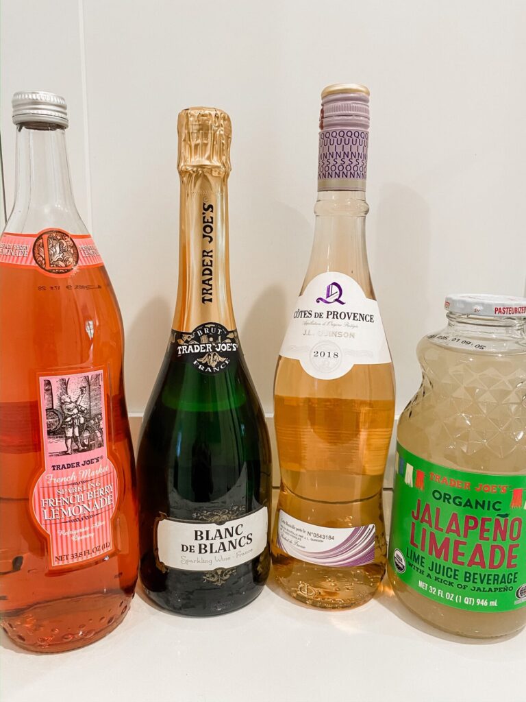 Trader Joe's Haul by popular Nashville lifestyle blog, Hello Happiness: image of Trader Joe's Blanc de Blancs, Trader Joe's Organic Jalapeno Limeade, Trader Joe's Cotes de Provence, and Trader Joe's sparkling French Berry Lemonade. 