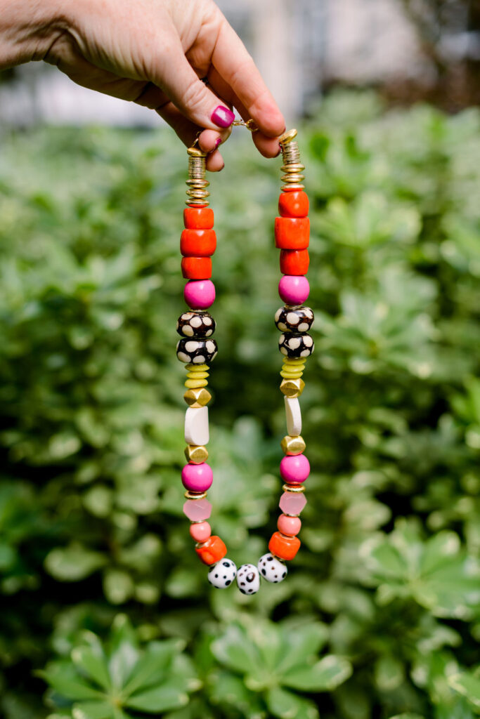 Accessory Concierge by popular Nashville fashion blog, Hello Happiness: image of Natasha Stoneking holding the Accessory Concierge Natasha Beaded Necklace.