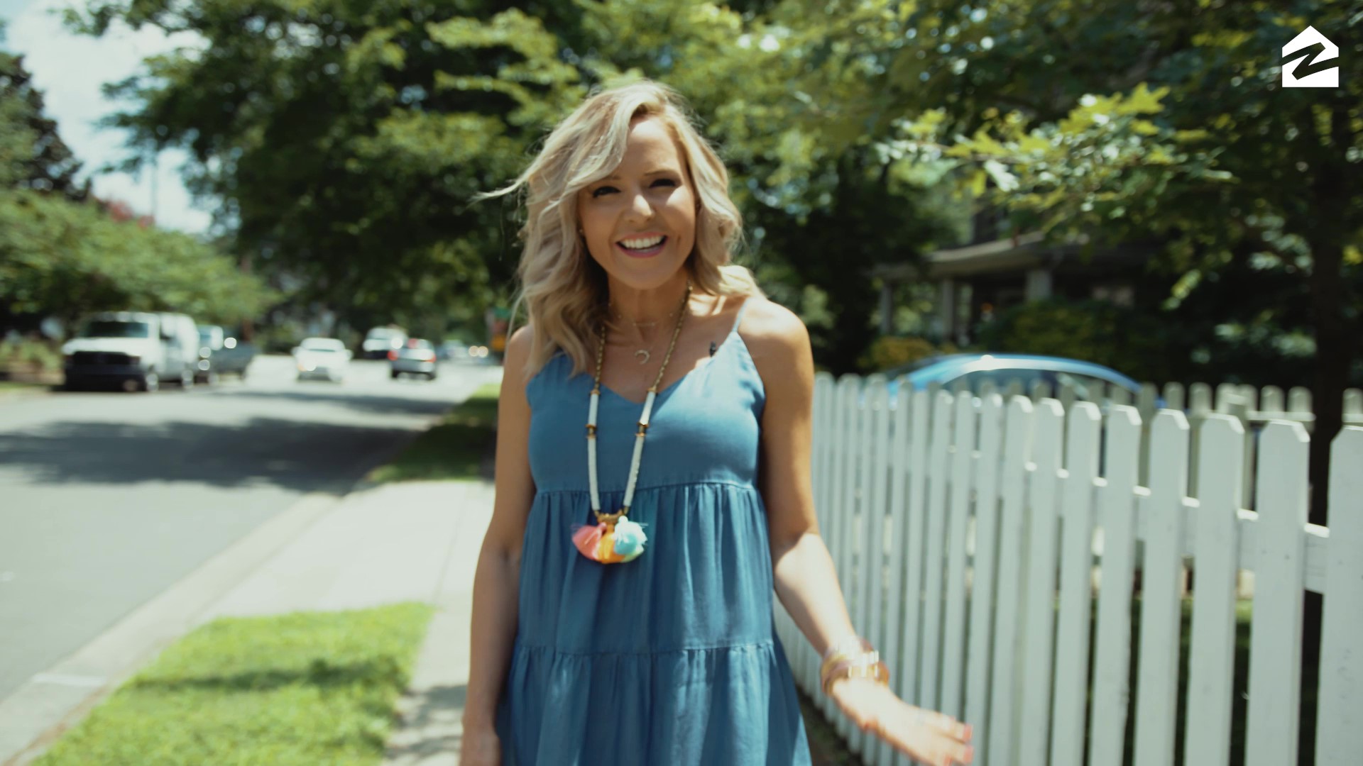 Zillow Offers... Welcome to Nashville!!! by popular Nashville blog, Hello Happiness: image of a woman walking outside next to a white picket fence.