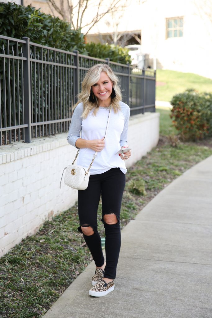 Leopard Print favorites featured by top US fashion blog, Hello Happiness: image of a woman wearing leopard  print sneakers