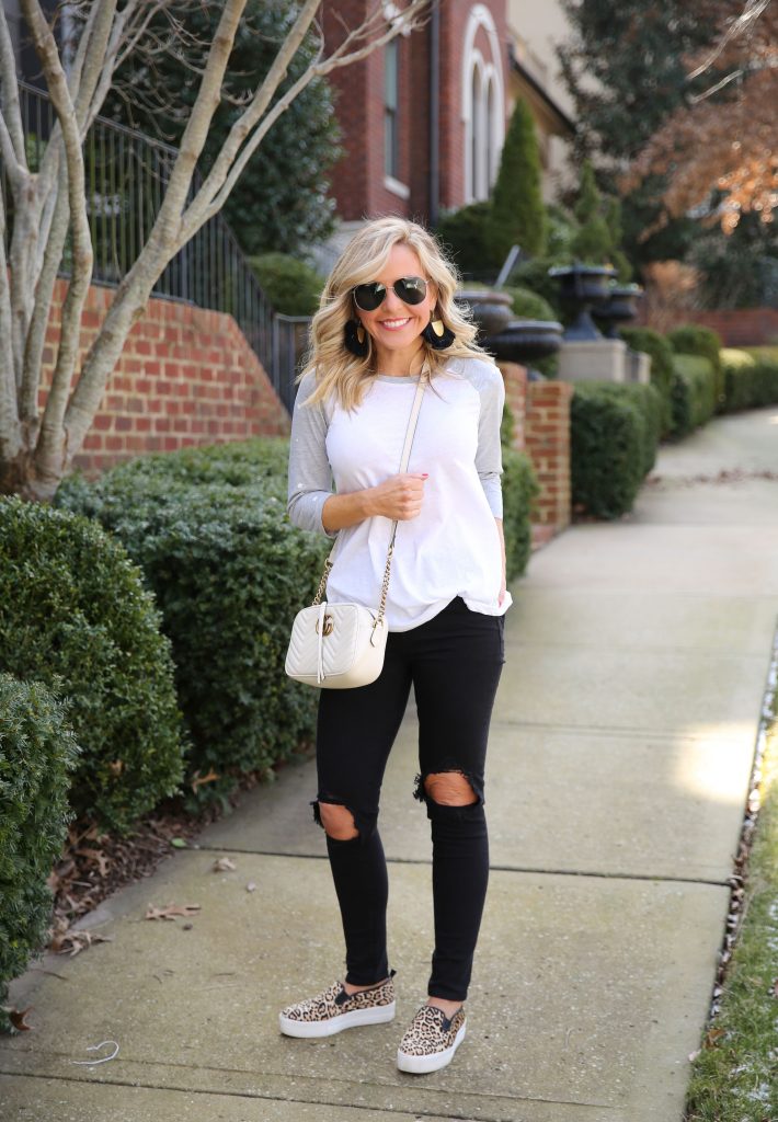 Leopard Print favorites featured by top US fashion blog, Hello Happiness: image of a woman wearing leopard  print sneakers