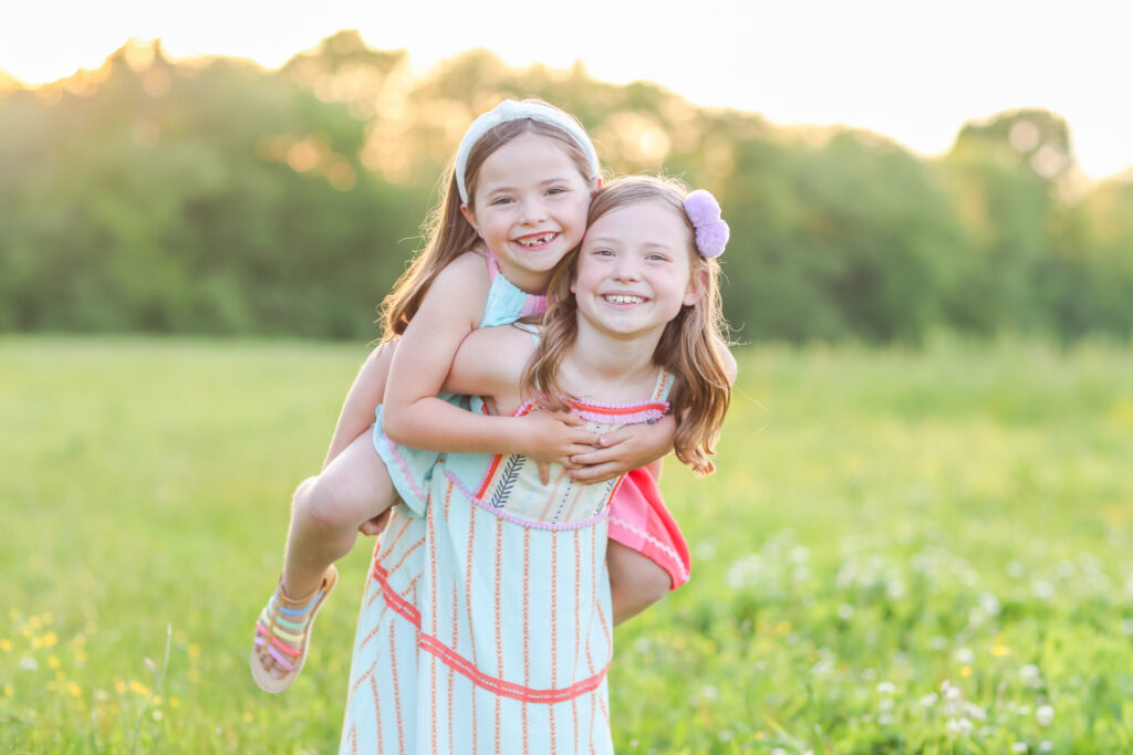 Year in Review by popular Nashville lifestyle blog, Hello Happiness: image of two girls standing together in a field. 
