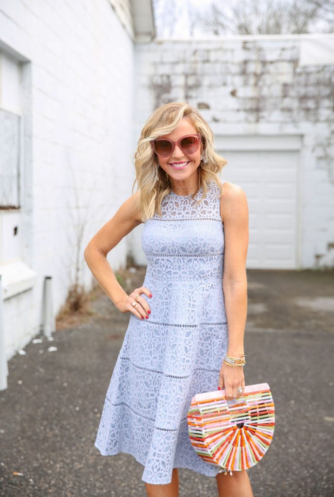 Cute Spring Dresses featured by top US fashion blog Hello! Happiness; Image of a woman wearing Eliza J Dress, Rainbow Bamboo Bag, Crescent Bangle, Savannah Bangle, Pearl Cable Classic Bracelet, Blue Topaz Cable Bracelet, White Flower Earrings, Pink Luna Sunglasses and Eyelet Wedges.