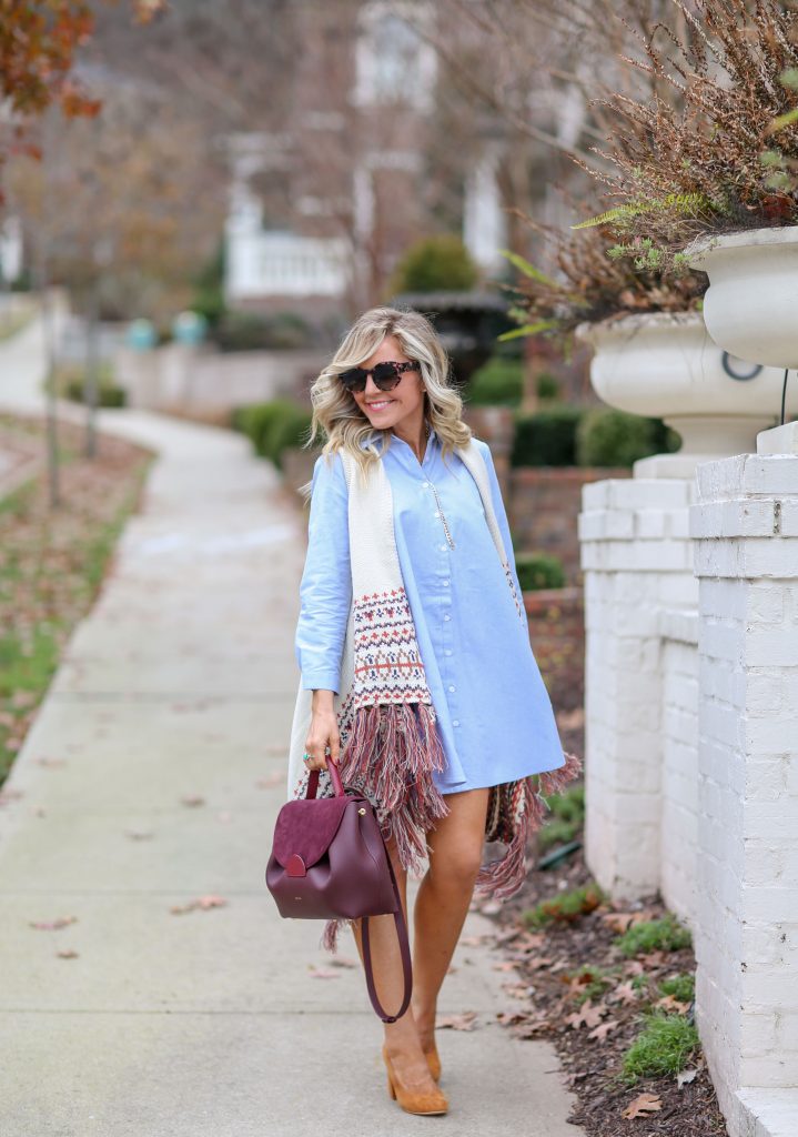 Cute Spring Dresses featured by top US fashion blog Hello! Happiness; Image of a woman wearing BB Dakota dress, Jude Nordic fringe vest, ABLE heels, Luna sunglasses and Polene bag.
