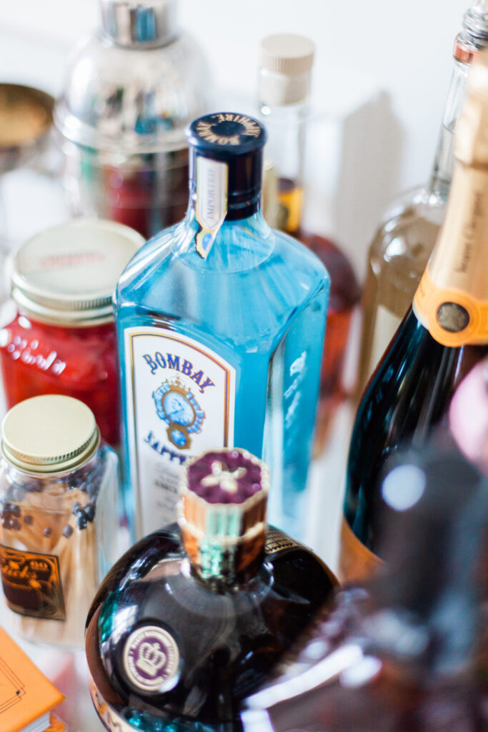 Bar Cart Essentials by popular Nashville lifestyle blog, Hello Happiness: image of various alcoholic drinks. 